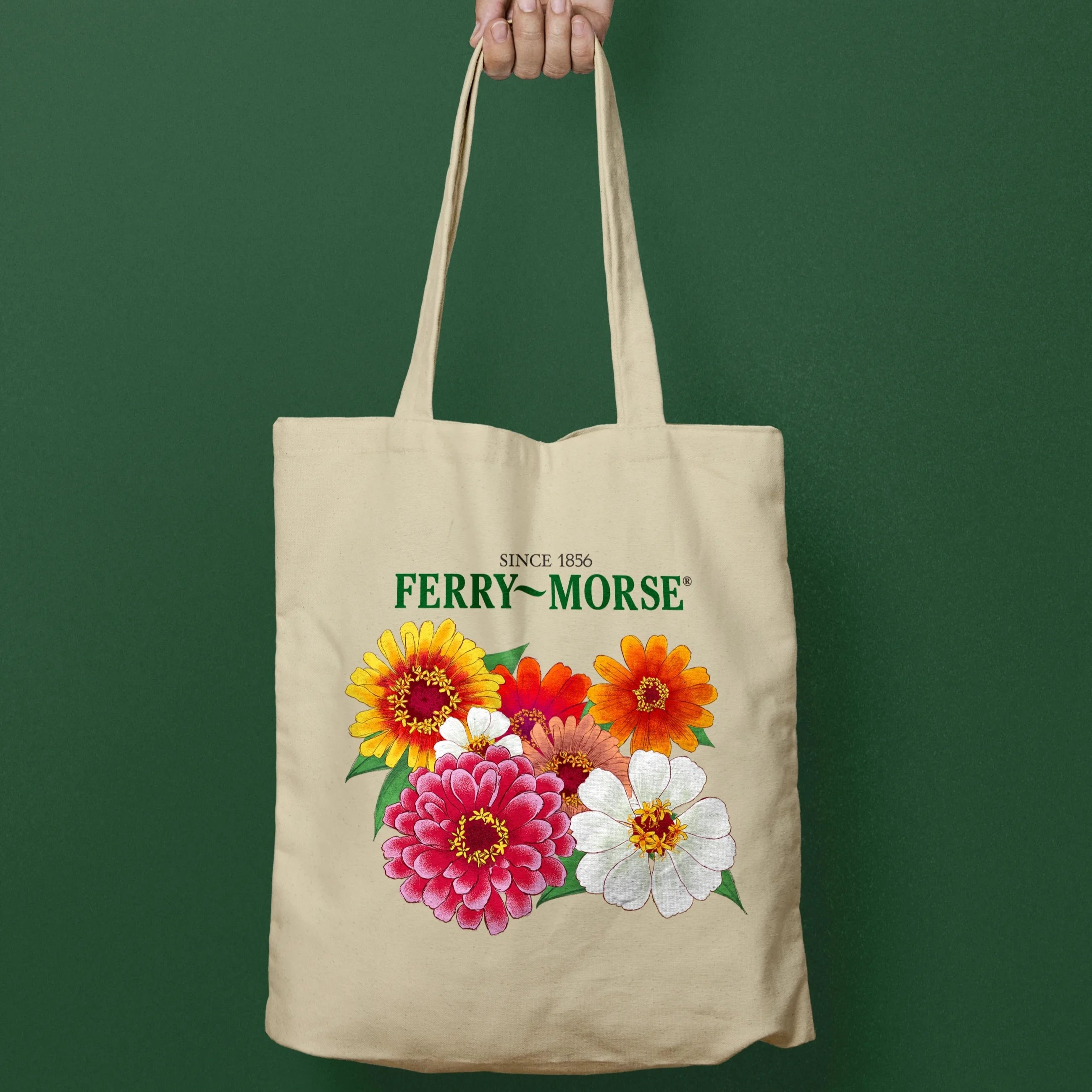 A beige bag with colorful zinnias printed on the front